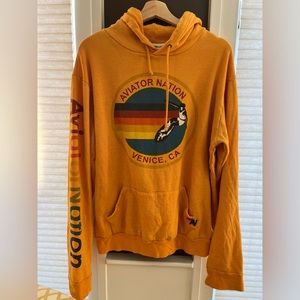 Mustard yellow logo hoodie.